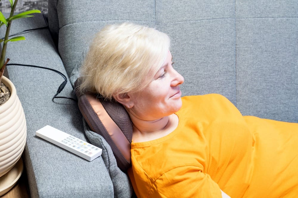 Woman using a home massage device