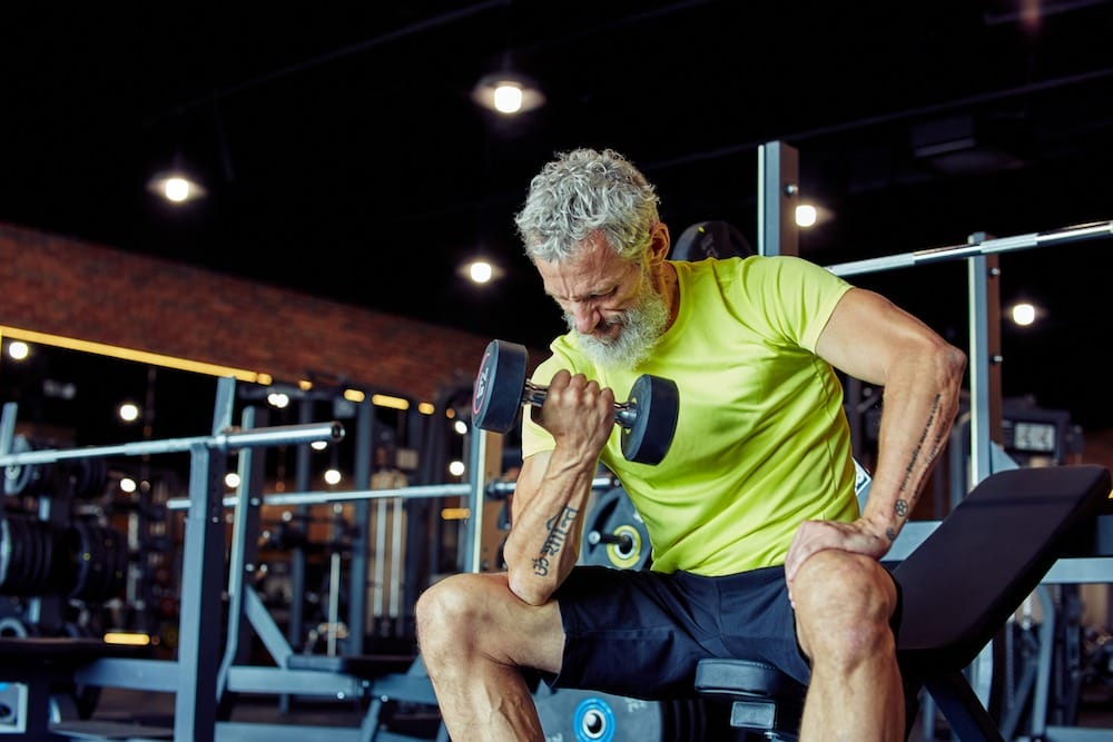 Aging man working out after taking testosterone boosters